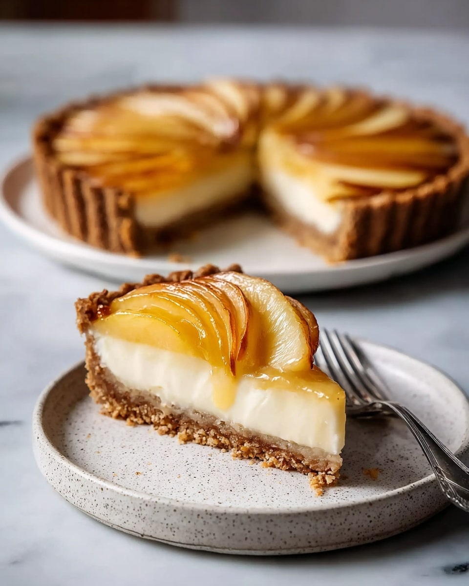 A slice of tart with three visible layers is placed on a white speckled plate; the bottom layer is a crumbly brown crust, the middle layer is a smooth cream-colored filling, and the top layer consists of thinly sliced golden-brown glazed fruit arranged in a fan shape. In the background, the rest of the tart sits on a white plate on a white marbled surface. A silver fork rests beside the tart slice on the plate. photo taken with an iphone --ar 4:5 --v 7