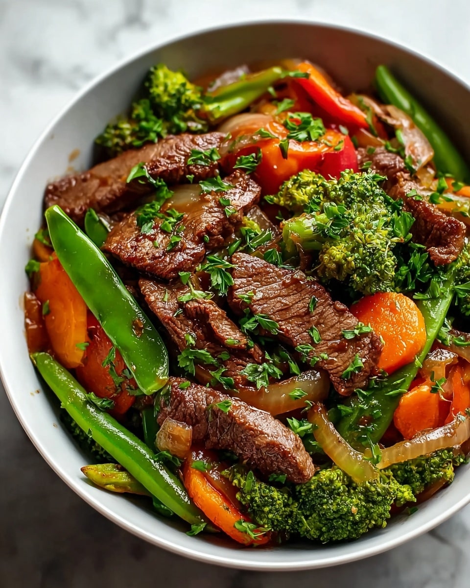 A white bowl filled with a colorful stir-fry dish consisting of several layers; the bottom layer is bright green snap peas and small broccoli florets with a rough texture; above that are thick orange carrot slices and translucent cooked onion pieces; the top layer shows browned, juicy beef strips with a slightly shiny, tender texture, all sprinkled with small green chopped herbs. The bowl is placed on a white marbled surface. photo taken with an iphone --ar 4:5 --v 7